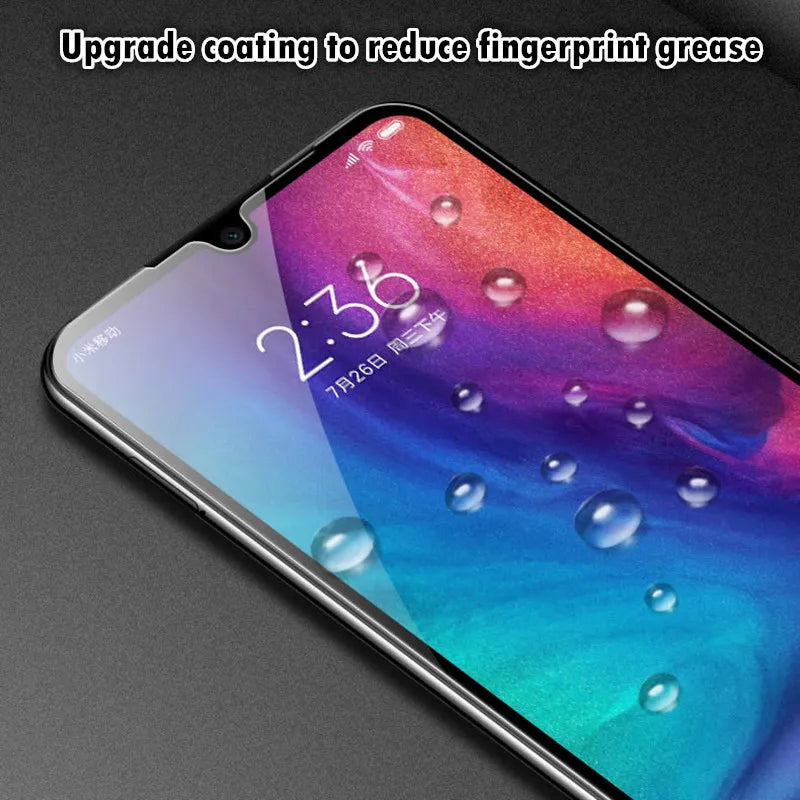 A Xiaomi device featuring a colorful screen displays the time as 2:38. Above, it says, Upgrade coating to reduce fingerprint grease. Water droplets on the LITBOY Tempered Glass Protector accentuate its excellent smudge resistance.