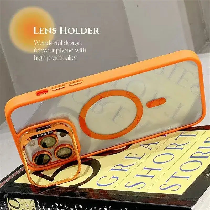 Orange Luxury Magnetic Shockproof iPhone Case with Lens Protection displayed on a book, showcasing sleek design and superior durability.