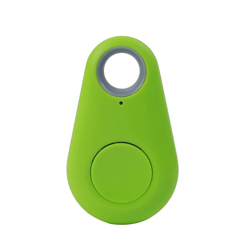 The Mini Smart Bluetooth Tracker - GPS Locator for Pets is a bright green device with a central circular button and a top hole for keyring attachment, offering a simple compact design for real-time tracking anywhere.