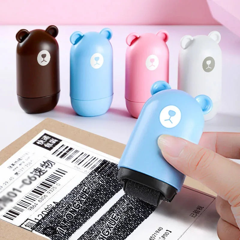 Four NoEnName Roller Stamp - Quick Drying Privacy Seal rollers in brown, blue, pink, and white stand on a table. A hand uses the quick drying blue roller to cover text for privacy. Enjoy free shipping!.