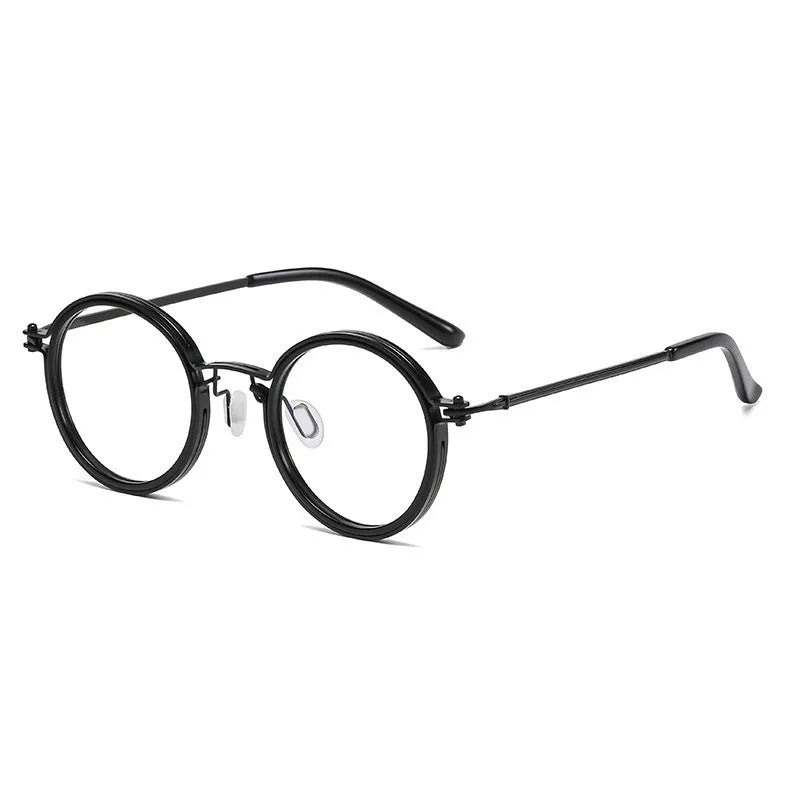 KLASSNUM Mens Round Glasses feature stylish retro black rims, thin metal arms, clear nose pads, and anti blue light lenses, shown on a white background.