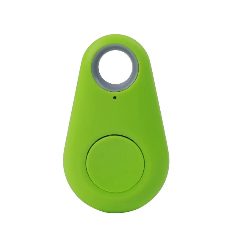 The Mini Smart Bluetooth Tracker, a green GPS locator for pets, features a circular button and loop for easy keychain attachment. This device offers real-time tracking to ensure you never lose your keys again.