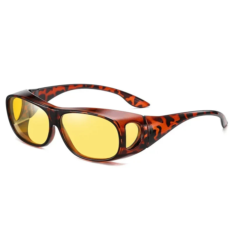 The MOKDUFF Polarized Sunglasses provide a modern look with brown tortoiseshell wrap-around frames, UV400 yellow lenses, and side shields for added protection, ensuring style and safety while fitting comfortably over glasses.