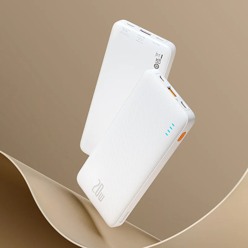 Two white Baseus Airpow 20W Power Banks (10000mAh) float against a beige background, showcasing sleek design with USB ports, LED indicators, and brand markings.