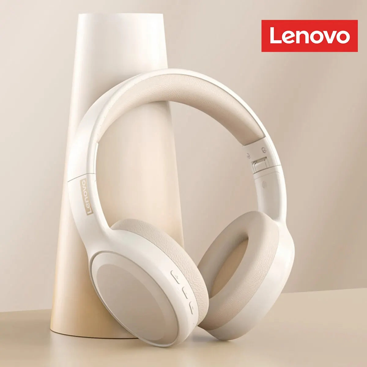 In front of a smooth, cone-shaped object, the beige and white Lenovo TH30 Wireless Headphones showcase their padding and high-fidelity sound. The Lenovo logo is visible in the top right corner, all set against a neutral backdrop.