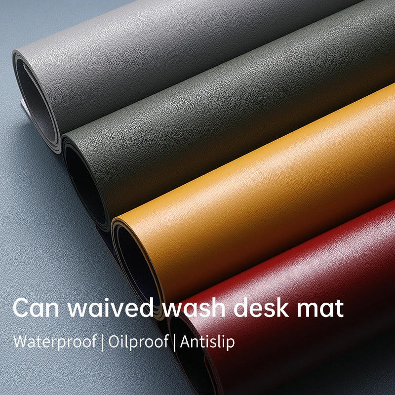 Four rolled desk mats appear in gray, green, yellow, and red with the text: Xummen Large Mouse Pad - Waterproof PU Gaming Desk Mat | Oilproof | Non-Slip Base.