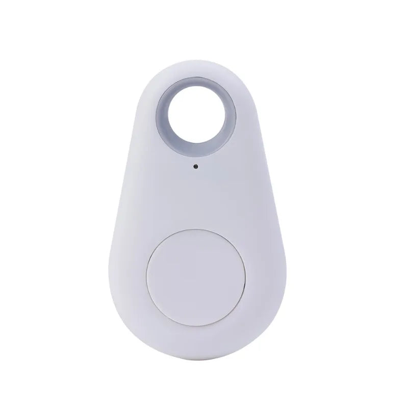 The Mini Smart Bluetooth Tracker - GPS Locator for Pets is a small, teardrop-shaped white device with a circular cutout at the top, featuring a round button on the lower half and a tiny dot above it, likely a light or sensor, enabling real-time tracking to ensure nothing gets lost.