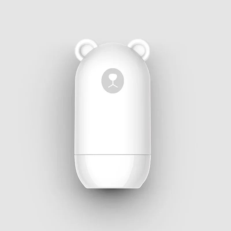 The NoEnName Roller Stamp - Quick Drying Privacy Seal features a white, capsule-shaped design with bear ears and a simple bear face on the front, shown against a plain light gray background.