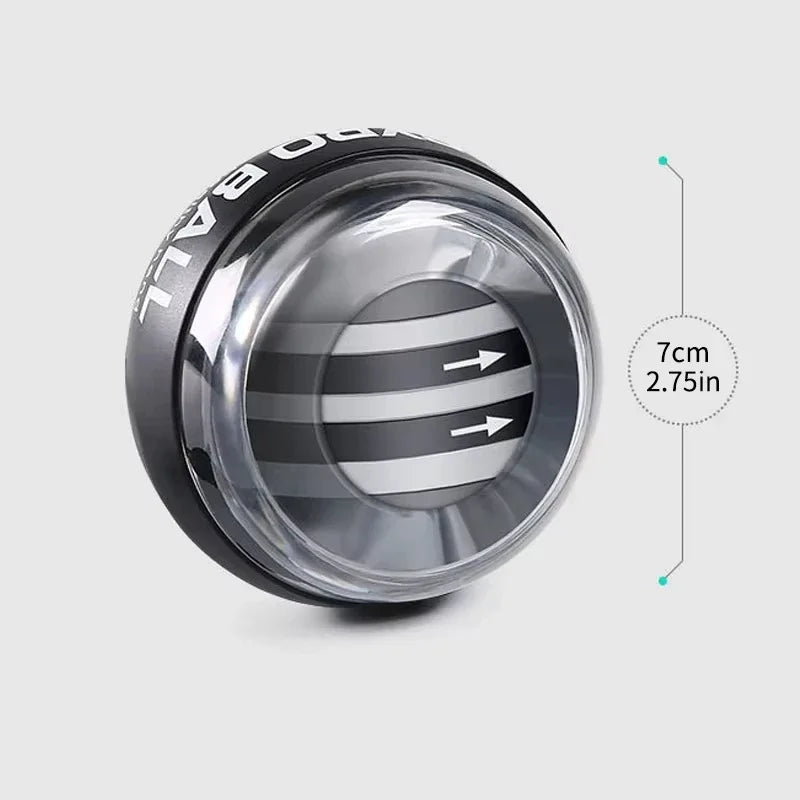 The Gyroscope Power Ball Forearm Strength Trainer, with a black outer shell and transparent casing revealing striped arrows, measures 7 cm (2.75 in) in diameter and is perfect for strength training.