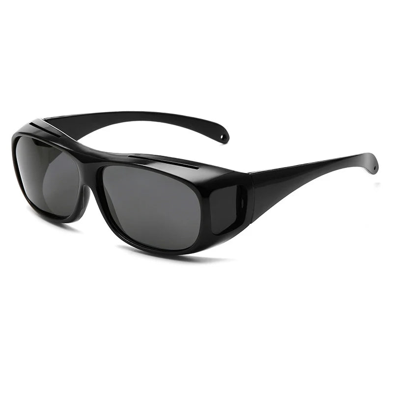 The NoEnName Night Vision Glasses feature thick frames, wide and smoothly curved arms, and dark lenses, perfect for driving. They sit against a white background and offer black, anti-glare protection.