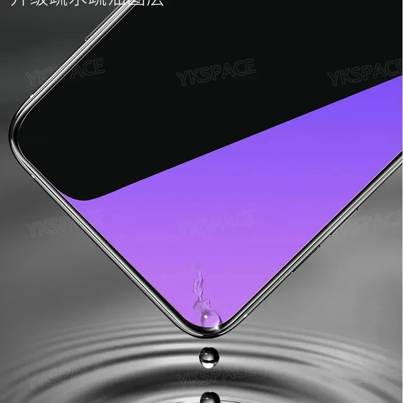 A close-up shows the YKSPACE 2Pcs Anti Blue-Ray Tempered Glass Screen Protector on a smartphone with a purple and black screen, angled above water as a drop falls from its edge, creating ripples below.