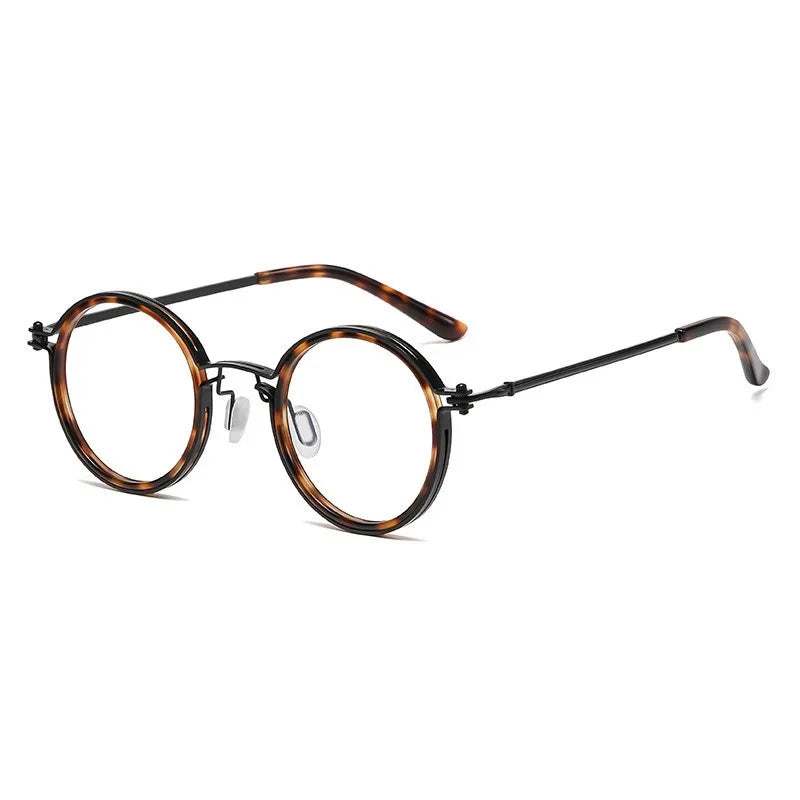 KLASSNUM Mens Round Glasses feature a retro tortoiseshell frame, thin black metal arms, anti blue light lenses, and clear nose pads. The glasses are angled stylishly on a white background.