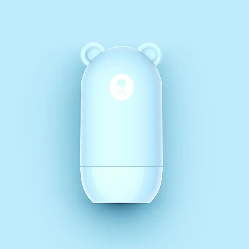 The NoEnName Roller Stamp - Quick Drying Privacy Seal features a light blue, capsule shape with small bear ears and a simple bear face design on a matching light blue background.