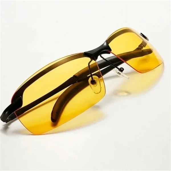 HARKO Polarized Night Vision Cycling Sunglasses with a sleek dark frame on a light surface are perfect for outdoor adventures.