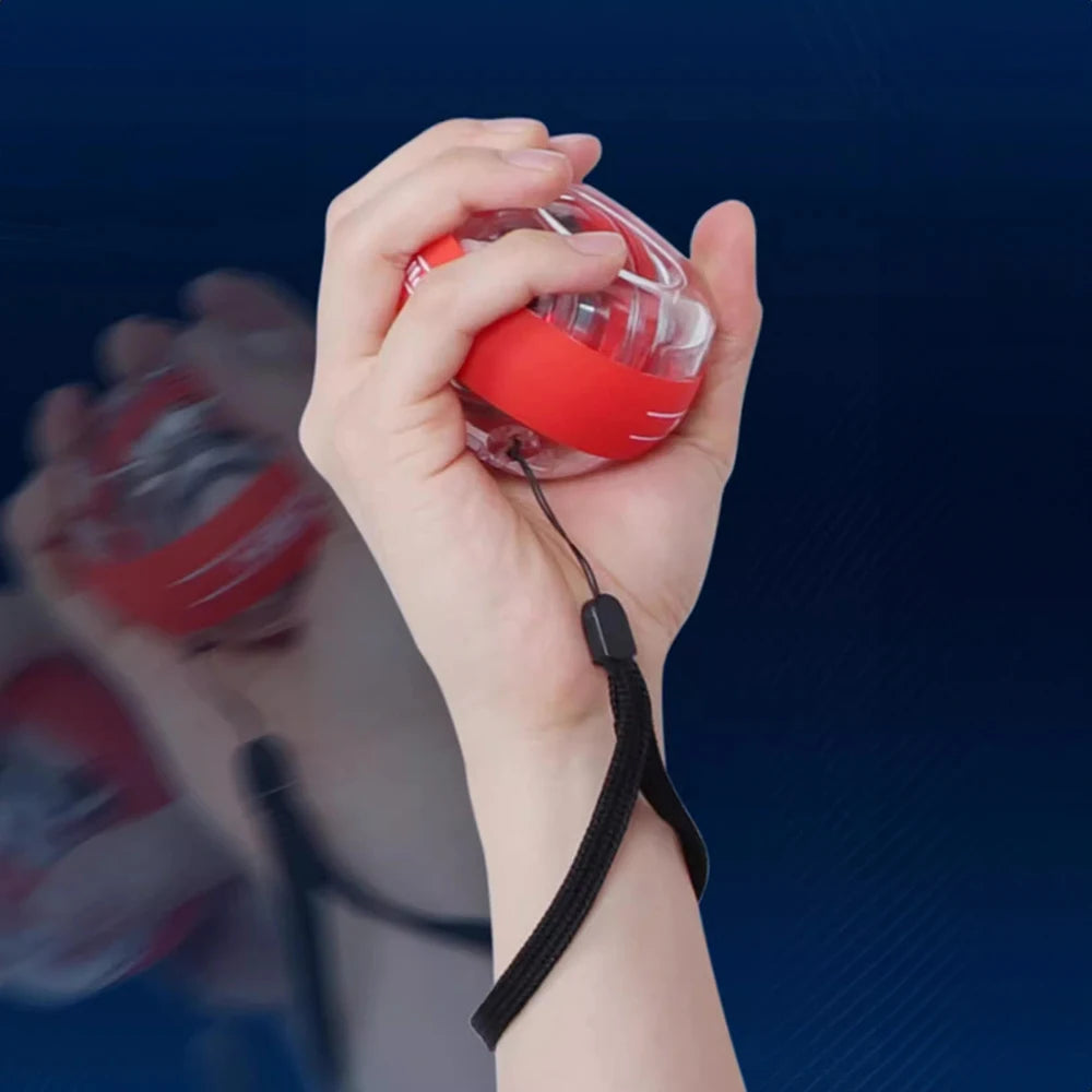 A red and transparent Wrist Trainer Self-starting Gyro Ball, secured with a black strap, is gripped by a hand. Capturing motion blur against a blue background, it highlights effective wrist training.