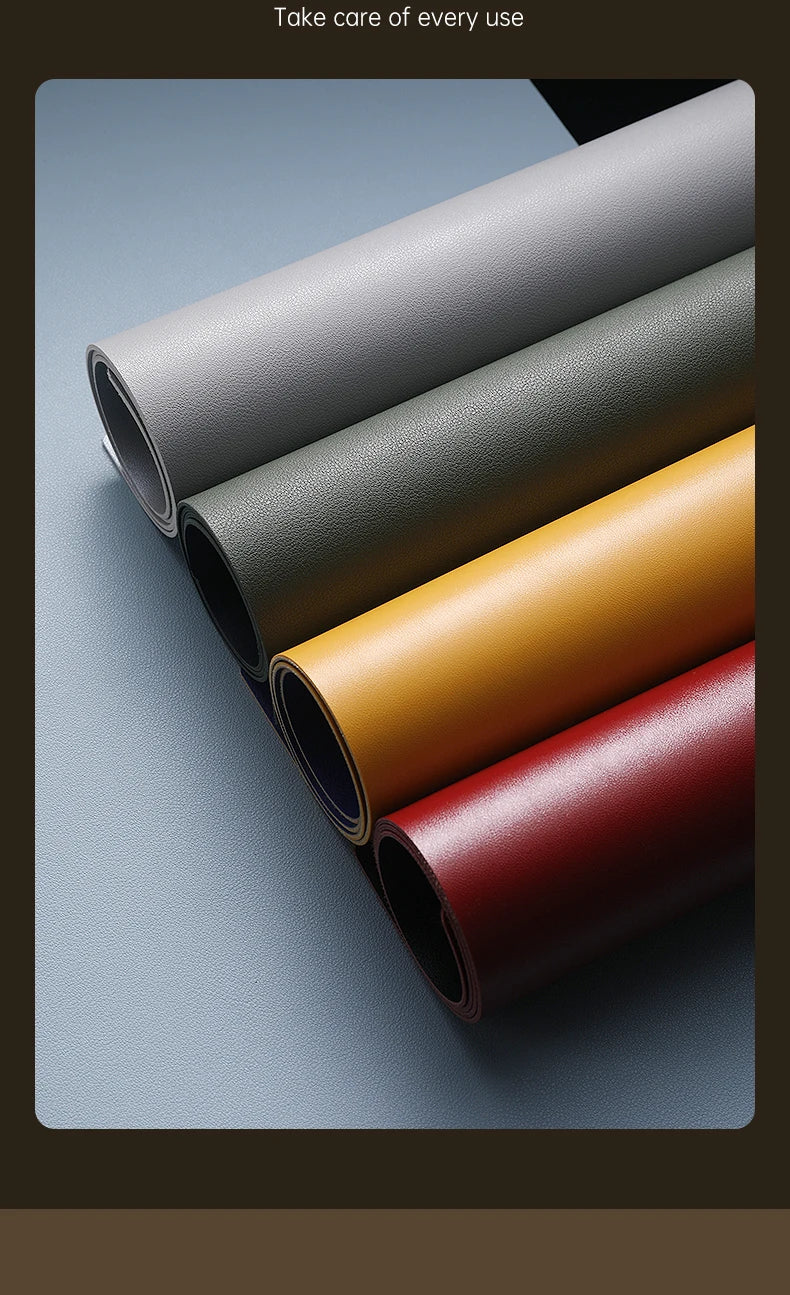 Five rolls of faux leather in gray, green, yellow, red, and black are neatly arranged on a flat surface. They have a smooth texture and slight sheen. Overhead is the message: Take care of every use. Ideal for making your own Xummen Large Mouse Pad - Waterproof PU Gaming Desk Mat with non-slip base.