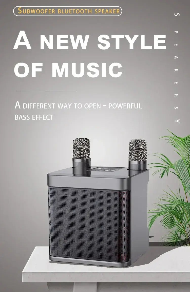 On a sleek white surface, the Portable Dual Microphone Bluetooth Karaoke Machine for Parties stands out, showcasing its stylish subwoofer, powerful bass effect, and text that reads A new style of music and A different way to open. A leafy plant is partially visible on the right.