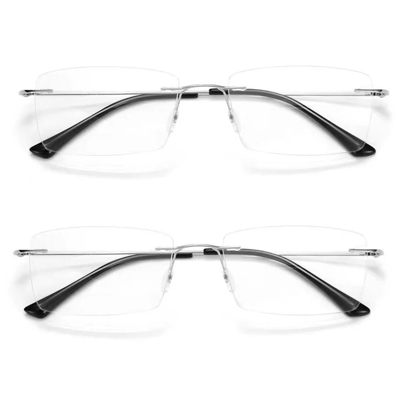 Two pairs of YINSQER Titanium Rimless Reading Glasses - Blue Light Blocking, featuring thin silver bridges and black temple tips, are displayed from a top-down view against a white background.