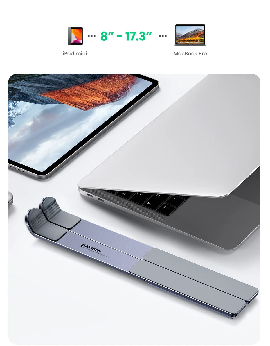 The image depicts the UGREEN Laptop Stand - Adjustable Foldable Aluminum next to an open MacBook Pro. It fits devices from 8” to 17.3” and showcases its ergonomic, foldable design by holding an iPad mini in the top section, emphasizing its broad compatibility.