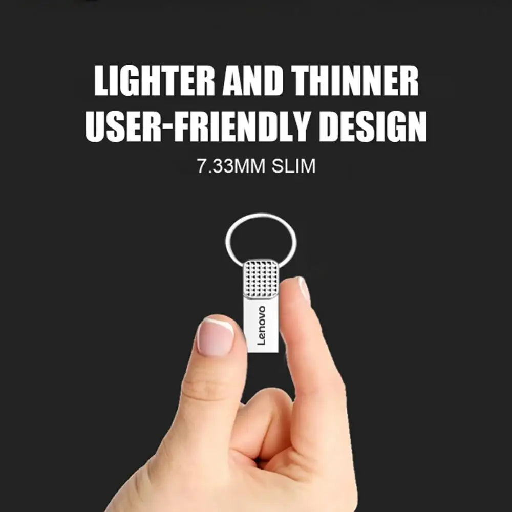 A hand holds a Lenovo 2TB USB 3.0 OTG Pen Drive featuring a slim design of 7.33mm, paired with a silver keyring, against a black background. Text above reads: Lighter and thinner user-friendly design for high-speed performance.