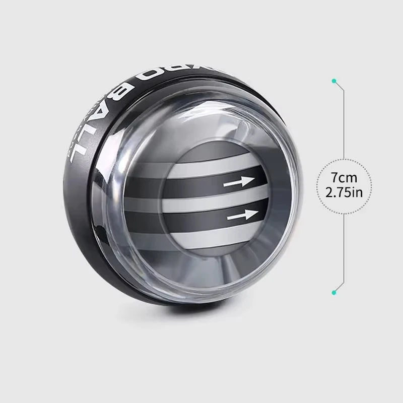 The Gyroball Powerball is a black and silver handheld device with a transparent casing displaying its internal spinning mechanism. Arrows indicate rotation direction to boost hand dexterity. With a 7 cm (2.75 inches) diameter, its perfect for forearm exercises.