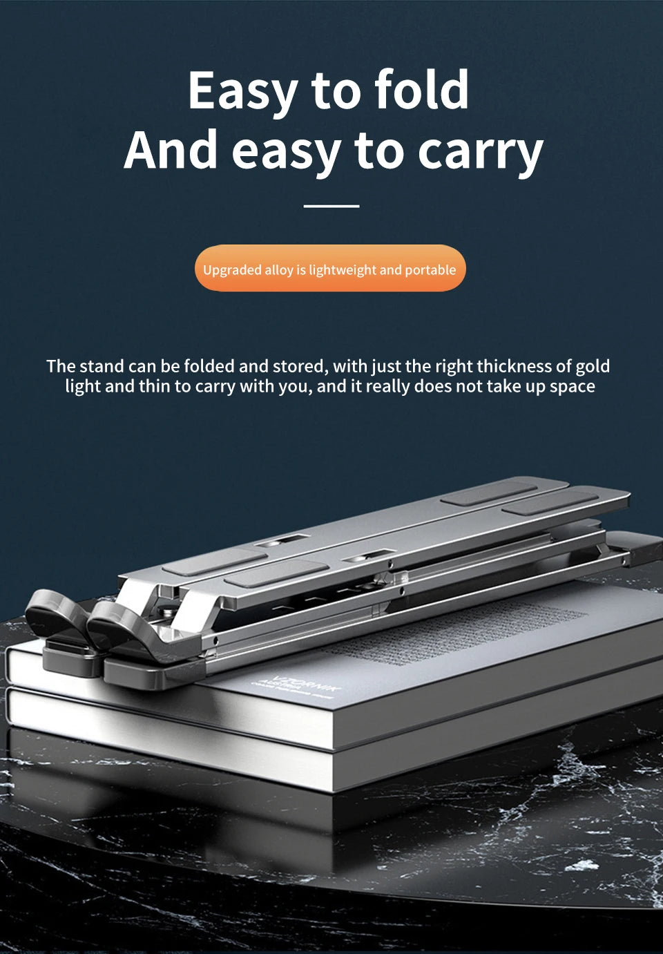 The Adjustable Aluminum Laptop Stand for Comfort and Portability sits on a closed book on a marble surface. Its sleek, foldable design emphasizes portability, lightweight nature, compactness for easy carrying and storage, while offering ergonomic comfort.