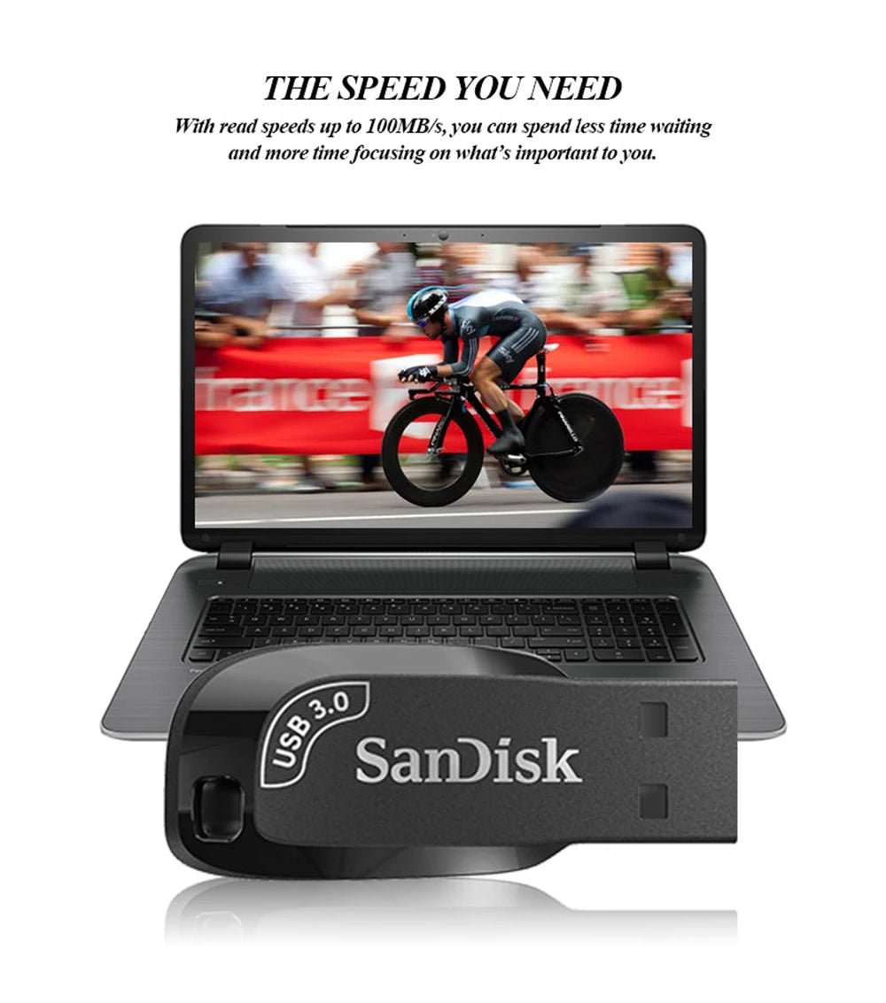 A SanDisk USB 3.0 Flash Drive - High-Speed Compact Storage lies in front of a laptop with a cyclist. Text above reads: THE SPEED YOU NEED. Enjoy high-speed data transfers up to 100MB/s, reducing wait times so you can focus on what matters most.