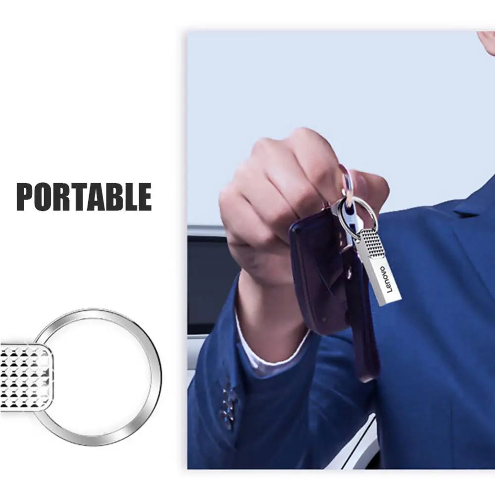 A person in a blue suit holds keys with a Lenovo 2TB USB 3.0 high-speed storage OTG pen drive attached, showcasing its sleek metal design. The word PORTABLE appears on the left side, emphasizing its efficient and convenient features.
