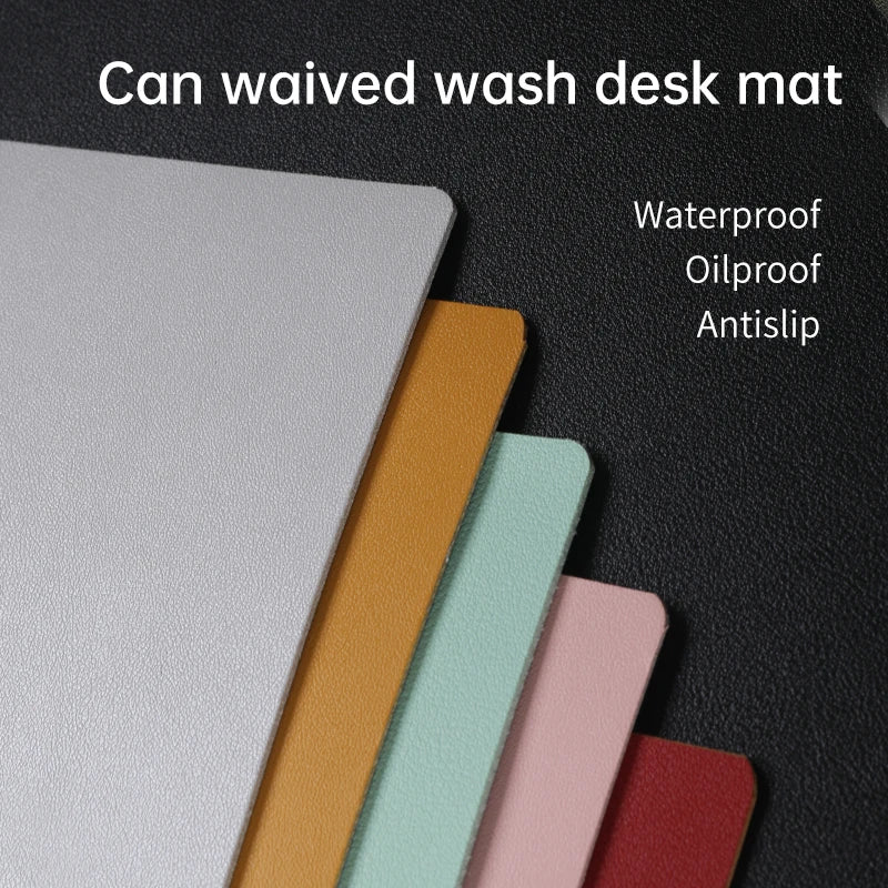 Five desk mats in colors gray, orange, mint, pink, and green are on a dark surface. The text reads: Can waived wash Xummen Large Mouse Pad - Waterproof PU Gaming Desk Mat. A non-slip base keeps it steady for daily use.