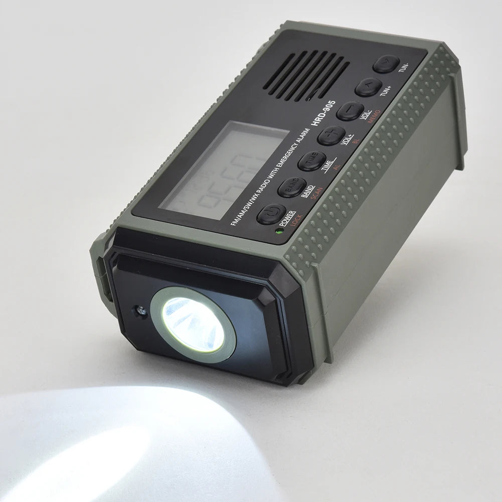 The APWIKOGER 10,000mAh Solar Hand Crank Emergency Radio, with a digital display, control buttons, and speaker in a green design with black accents, is both stylish and functional.