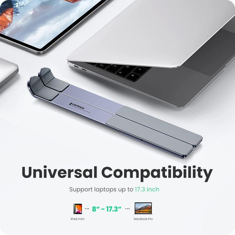 On the table, a laptop and tablet rest on the UGREEN Laptop Stand - Adjustable Foldable Aluminum. Text reads Universal Compatibility, supporting up to 17.3-inch laptops, iPad mini, and MacBook Pro. Its ergonomic design allows comfortable use with adjustable height.