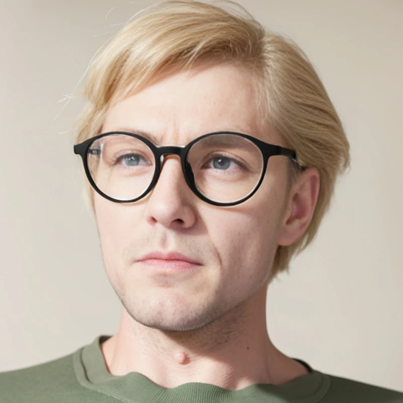A person with short blonde hair and black-rimmed glasses, featuring OUTMIX Pure Titanium Anti Blue Light Reading Glasses, looks slightly to the side. Wearing a green shirt against a neutral background, they enjoy stylish frames with free shipping—comfort and convenience combined.