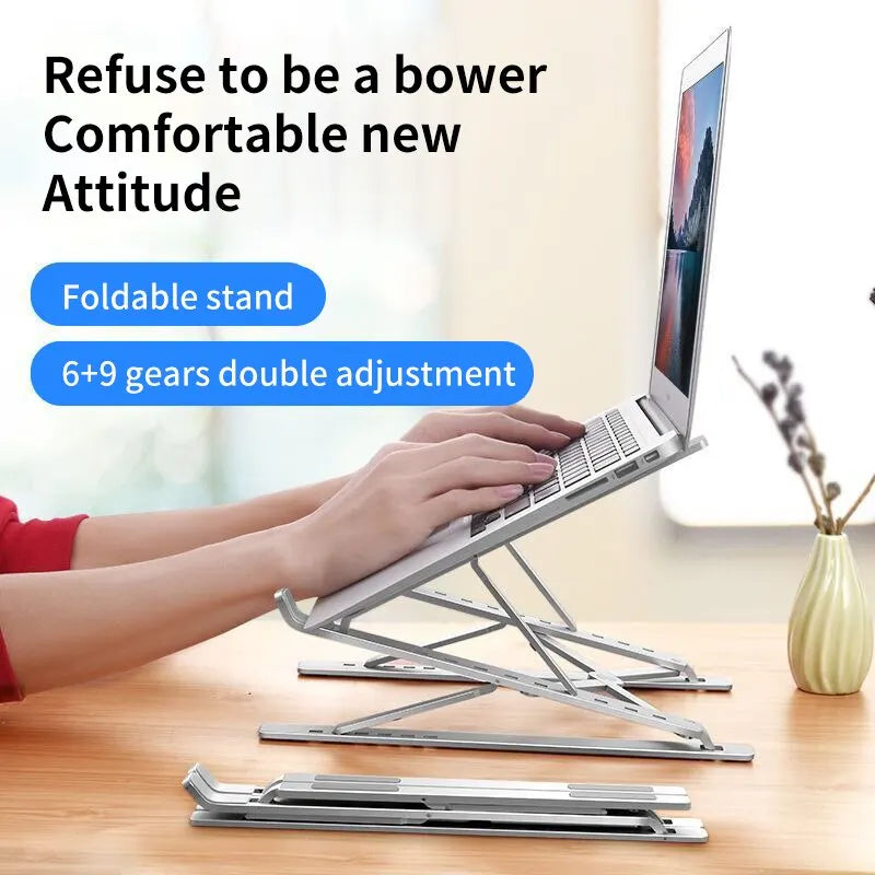 A person types on a laptop placed on an Adjustable Aluminum Laptop Stand for Comfort and Portability. The text above reads, Refuse to be a bower Comfortable new Attitude, with a plant pot in the background enhancing the ergonomic comfort.