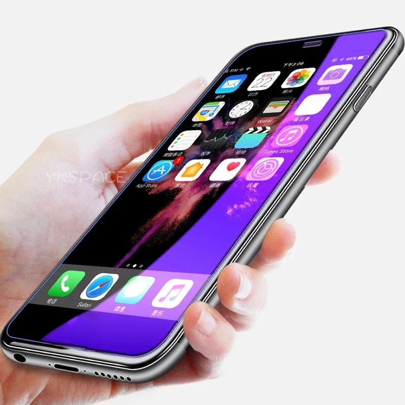 A hand holds a smartphone with a large display protected by the YKSPACE 2Pcs Anti Blue-Ray Tempered Glass Screen Protector, featuring colorful app icons on a purple and black background, rounded edges, and a sleek silver frame.