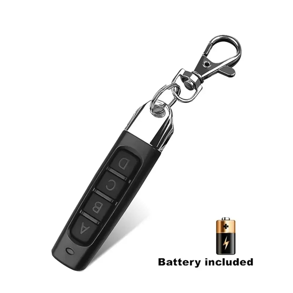 The Universal 433MHz Wireless Remote Control For Garage Access is shown in black with four buttons, a metal keychain clip, and includes a battery. Perfect for controlling doors and gates.
