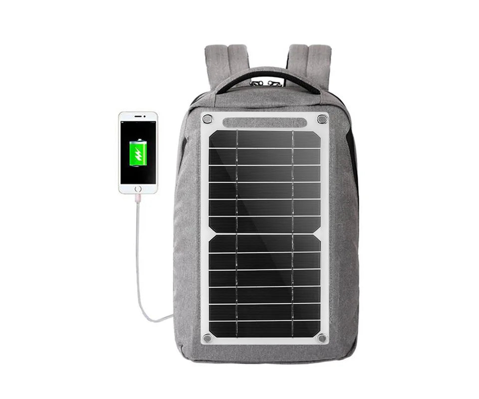 The EESBAO 35W Solar Panel backpack in gray charges a smartphone via an elegantly integrated front solar panel. Perfect for outdoor camping, the setup works as a portable USB charger, with the phone showing a charging icon while connected to the backpack.