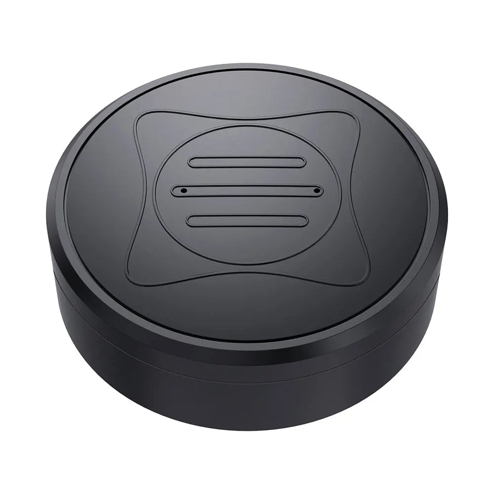 A black, circular wireless charger with a matte finish features an embossed pattern of subtle lines and curves, echoing the elegance found in the Mini GPS Tracker - Real-Time Magnetic Smart Locator. It sits against a plain white background, highlighting its minimalist design.