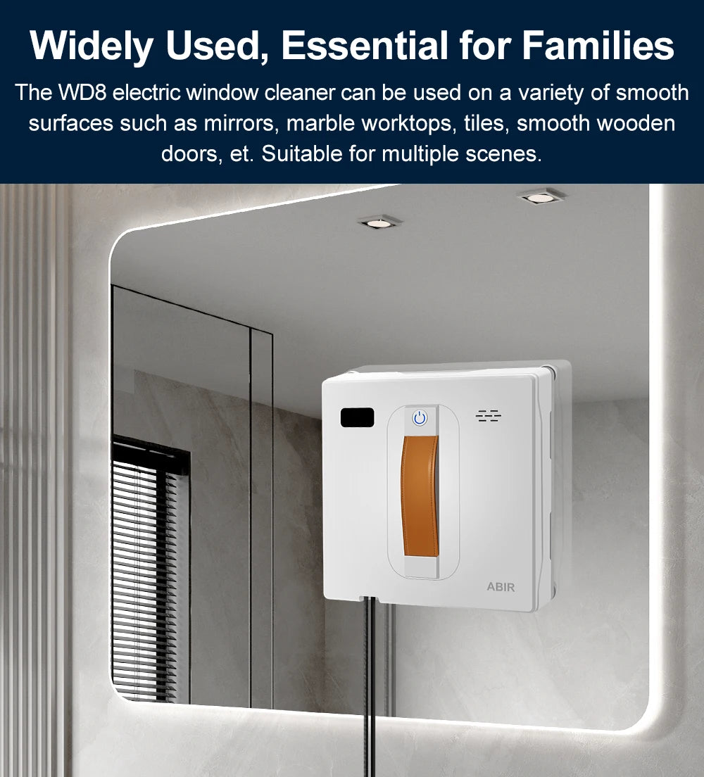 The ABIR WD8 Robot Window Vacuum, with a white body and orange handle, is attached to a large bathroom mirror. Its square shape and smart home integration make it versatile for cleaning surfaces such as mirrors, marble, tiles, and smooth wood.