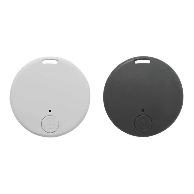 Against a white background, two NoEnName Bluetooth GPS Trackers are displayed: one in white and the other in black. They feature a small button at the bottom and a top hole for attachment, ensuring you effortlessly stay connected to your essentials.