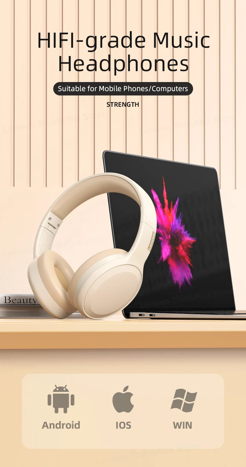 Lenovo TH30 Wireless Headphones in beige sit on a wooden surface before a laptop showcasing abstract art, emphasizing high-fidelity sound. These Bluetooth 5.3 noise-canceling headphones are perfect for Android, iOS, and Windows platforms.
