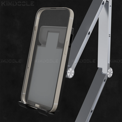 The Artpowers Adjustable Tablet Holder, featuring a sleek mechanical arm with universal compatibility, holds a smartphone in a beige case against a dark background. Its modern, minimalist design includes metallic accents and doubles as an adjustable stand for versatile use.