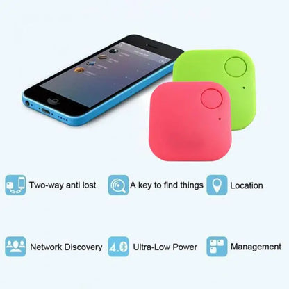 A smartphone is paired with two Smart Bluetooth 4.0 Anti-Lost Trackers for Valuables, in pink and green, perfect for tracking pets or keys. Features include two-way anti-lost alerts, key finder function, location tracking, network discovery, ultra-low power 4.0 tech, and management options.