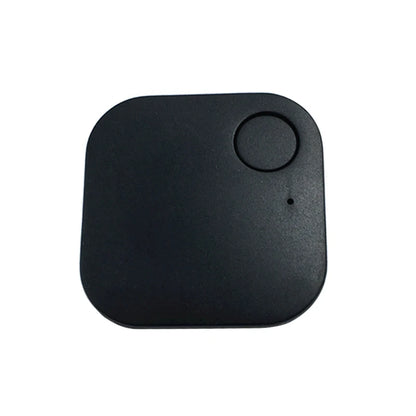 A compact, square black Smart Bluetooth 4.0 Anti-Lost Tracker for Valuables with rounded edges features a top-right circular button and an LED indicator hole below it, ideal for tracking keys or pets.