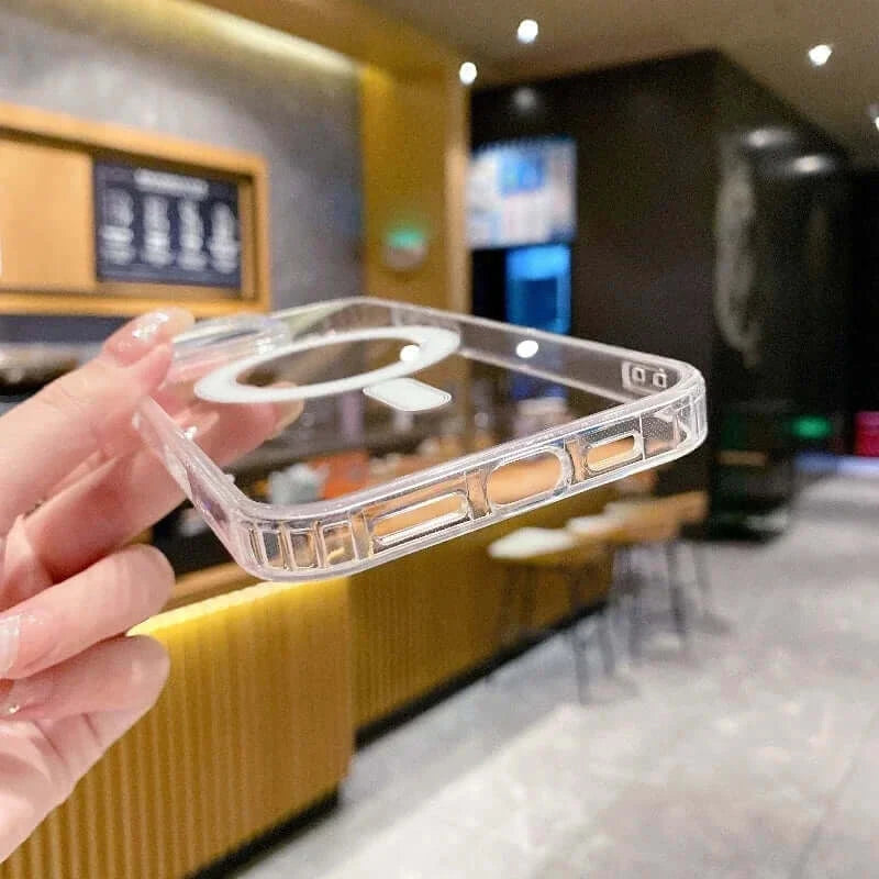 Transparent PC phone case with MagSafe wireless charging held in hand, showcasing sleek design and durability in a modern setting.