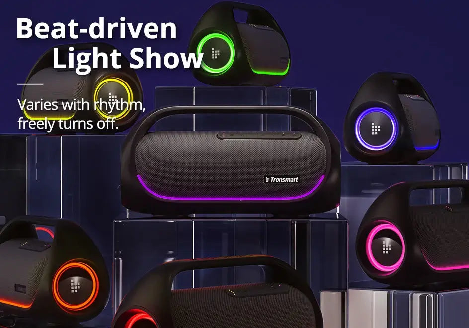 A set of Tronsmart Bang Speakers, 60W Bluetooth with heavy bass, sits on transparent stands against a dark blue background. The speakers feature colorful LED lights and a beat-driven light show that can be turned off via app control.