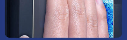 A close-up of a hand touching a smartphone screen protected by YKSPACE 2Pcs Anti Blue-Ray Tempered Glass Screen Protector, with a blue textured cloth in the background.