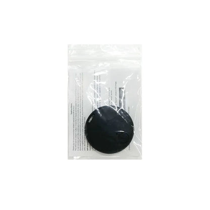 A Seamopar Mini GPS Tracker, a compact anti-lost Bluetooth key finder, lies in a clear plastic bag with a white sheet containing text beneath it.