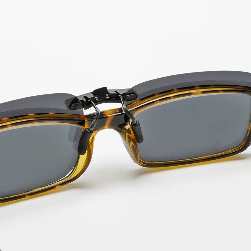 Close-up of Honey Joe Polarized Clip-On Sunglasses featuring UV400 protection. They have a retro yet modern style, with tortoiseshell frames and dark lenses, plus a unique folding mechanism at the bridge for compact storage.