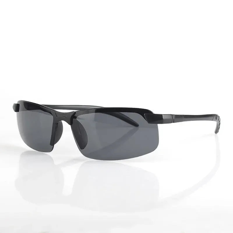 HARKO Polarized Night Vision Cycling Sunglasses, in sleek black with semi-rimless frames and dark rectangular lenses, are perfect for outdoor adventures and elegantly displayed on a reflective white surface.