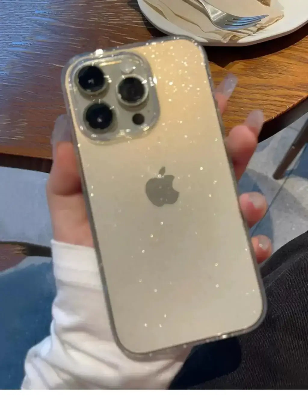 Luxury bling glitter clear phone case on iPhone Pro Max for stylish protection and elegance.